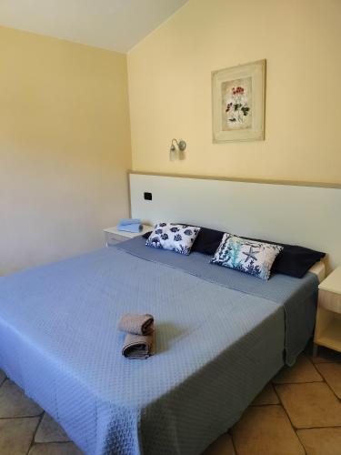 a bedroom with a bed with a towel on it at Heleni Apartment in Tortoreto Lido