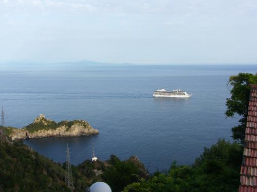 a cruise ship in a large body of water at Locanda Degli Agrumi in Conca dei Marini