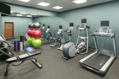 a gym with several exercise equipment in a room at Four Points by Sheraton Boston Logan Airport Revere in Revere