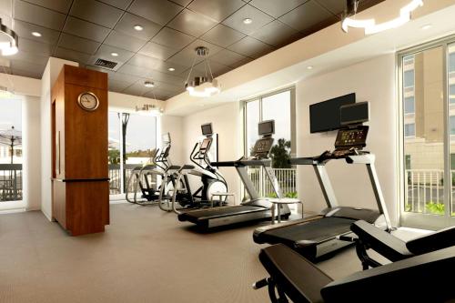 a gym with several treadmills and cardio machines at TownePlace Suites by Marriott Orlando Downtown in Orlando