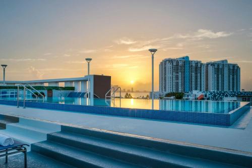 a rooftop pool with a view of a city at Residence Inn by Marriott Miami Beach South Beach in Miami Beach