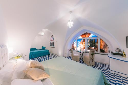 Postel nebo postele na pokoji v ubytování Diamond Ravello Suites