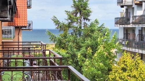 a view of the ocean from the balcony of a building at Rafa in Trzęsacz
