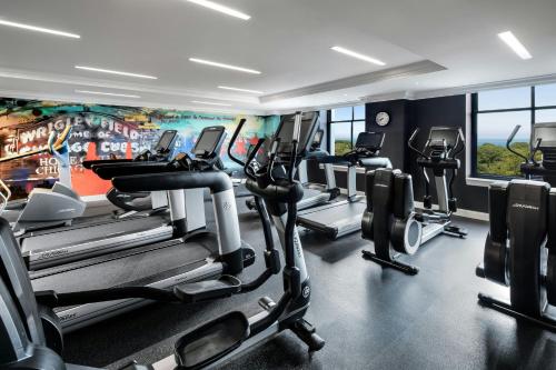 a gym with a bunch of tread machines in it at The Blackstone, Autograph Collection in Chicago
