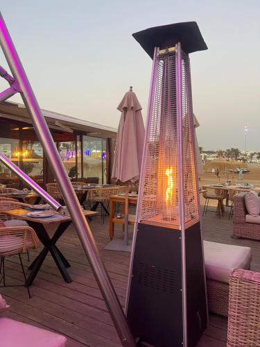 a bird cage sitting on top of a deck at Marina Home Prestige Agadir in Agadir