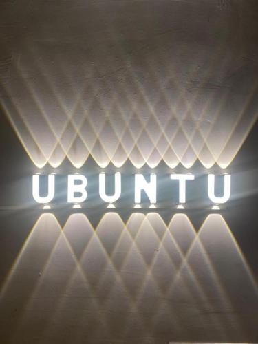 a sign that says ubuntu on the top of a bed at UBUNTU homestay 6 in Hanoi