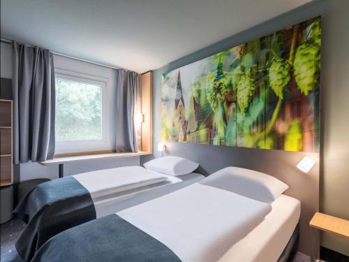 Postel nebo postele na pokoji v ubytování B&B Hotel Ingolstadt-Ost