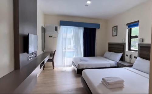 Ένα ή περισσότερα κρεβάτια σε δωμάτιο στο Green Nature Resort and Leisure Park Nagcarlan Laguna
