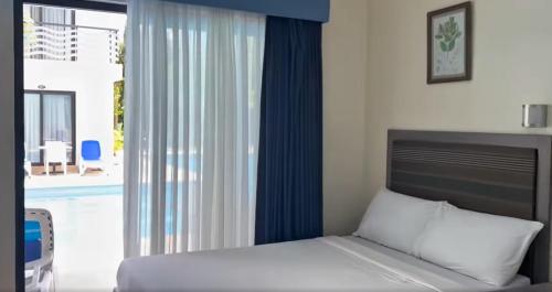 Ένα ή περισσότερα κρεβάτια σε δωμάτιο στο Green Nature Resort and Leisure Park Nagcarlan Laguna