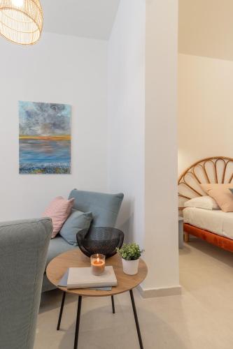 a living room with a couch and a table at mari DAMARI in Riposto
