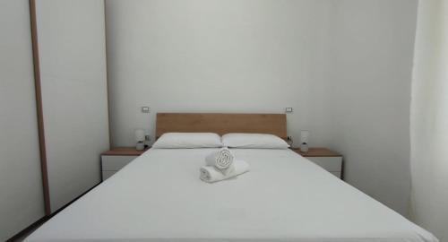 Ένα ή περισσότερα κρεβάτια σε δωμάτιο στο La Fontana