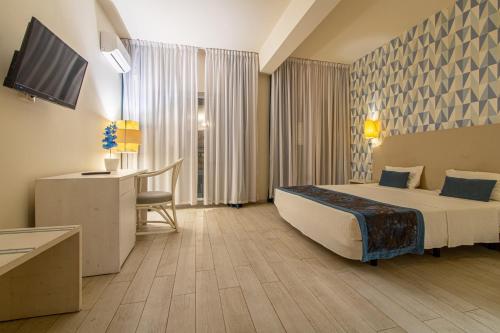 Ouril Hotel Aguedaにあるテレビまたはエンターテインメントセンター