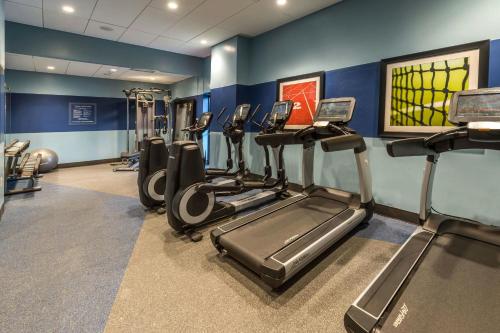a gym with several treadmills and elliptical machines at Four Points by Sheraton Juneau in Juneau