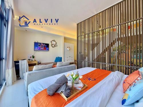 a hotel room with two beds and a couch at Alviv 99 Suites I Family Suite I 4-7 pax I 5minsMelakaCruise I JonkerSt in Melaka