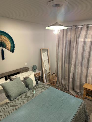 a bedroom with a bed with a mirror and a mirror at Top strandhuis aan zee! in Néa Meságkala