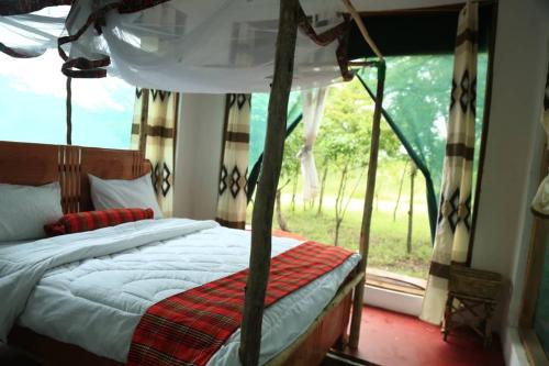 Postel nebo postele na pokoji v ubytování Double G safaris and Camp Mikumi