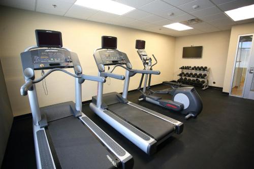 a gym with three tread machines in a room at Fairfield Inn & Suites by Marriott East Grand Forks in East Grand Forks