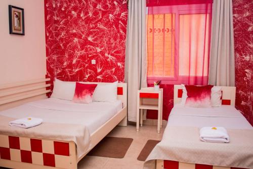Ein Bett oder Betten in einem Zimmer der Unterkunft Hotel Mahamanina