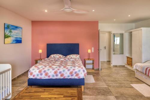 a bedroom with a large bed and two lamps at T3 - 100m2 - Résidence Georgette in Terre Sainte