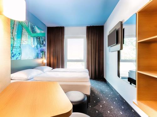 Cama ou camas em um quarto em B&B Hotel Chemnitz