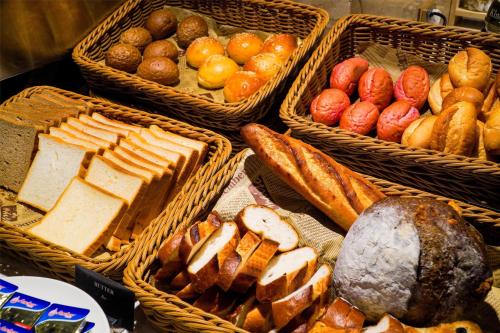 a bunch of baskets filled with different types of bread at Radisson Resort Mui Ne in Mui Ne