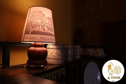 a lamp sitting on top of a table at La Pavoncella in Oristano