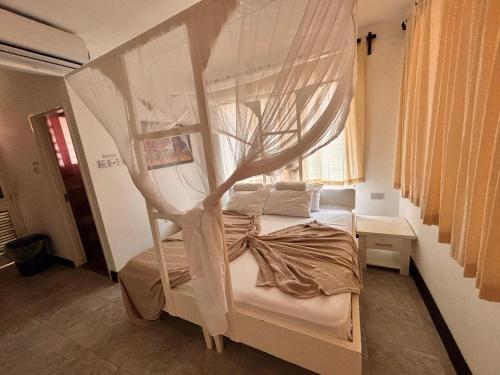 Ένα ή περισσότερα κρεβάτια σε δωμάτιο στο La Casa Di Nico Studio Tulips Hse 3