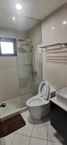 a bathroom with a toilet and a shower and a sink at Palette in Angeles Pampanga near Clark International Airport Formerly Boss Hotel in Angeles