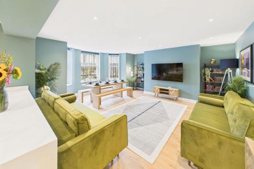 a living room with two couches and a tv at Host & Stay - The Georgian Quarter at Catharine House in Liverpool