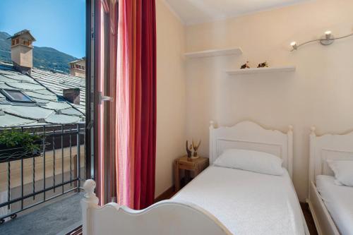 Ένα ή περισσότερα κρεβάτια σε δωμάτιο στο Maison Gnemaz Grand Combin