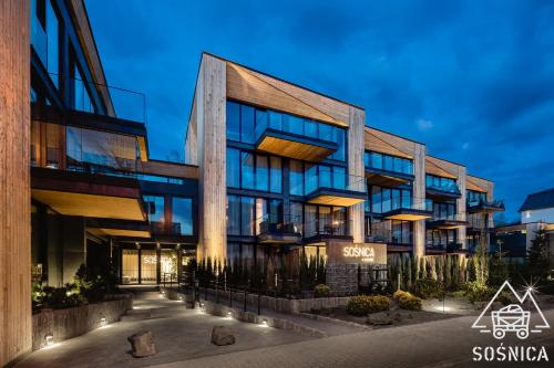 a rendering of a building at night at Sośnica Resort & SPA in Zakopane