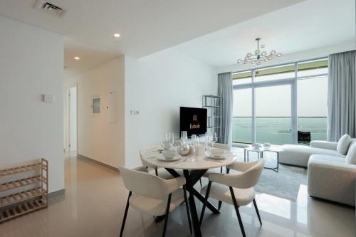 Beachfront 2BR w Palm & Sea Views