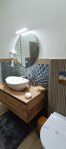 a bathroom with a sink and a mirror at La Maison dello Stretto in Messina