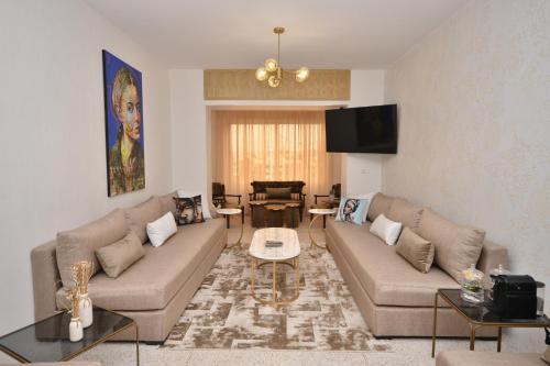 a living room with a couch and a table at Casablanca Penthouse Executive in Casablanca