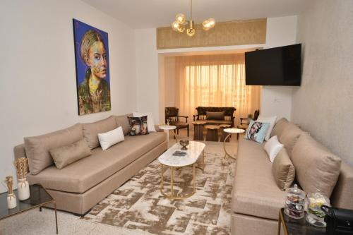 a living room with a couch and a table at Casablanca Penthouse Executive in Casablanca