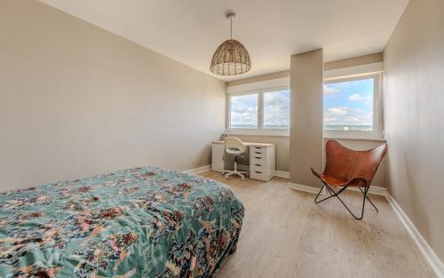 Ένα ή περισσότερα κρεβάτια σε δωμάτιο στο Appartement tout confort à Nancy