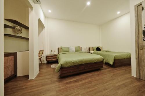 Ένα ή περισσότερα κρεβάτια σε δωμάτιο στο Lancelynk Homestay Danang