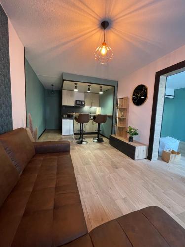 a living room with a couch and a table at The 8 in Lunéville