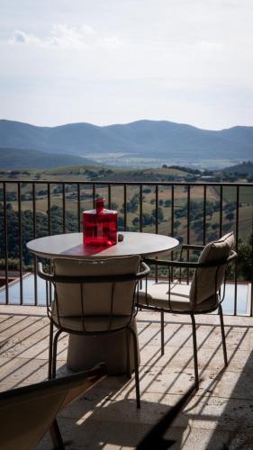 a table and chairs on a balcony with a view at Casale Oleo in Montiano