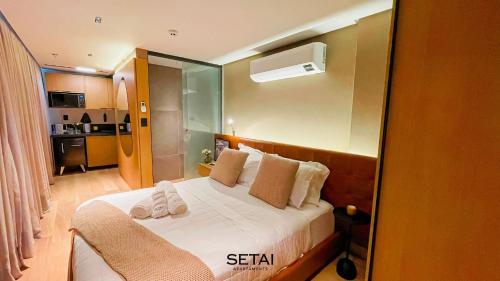 Una cama o camas en una habitación de Setai Edition By Setai Apartaments