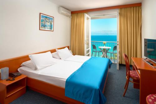 Postel nebo postele na pokoji v ubytování Hotel Faraon