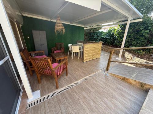 a patio with a table and chairs and a dining room at Hotel Rural Los Abriles in El Toro