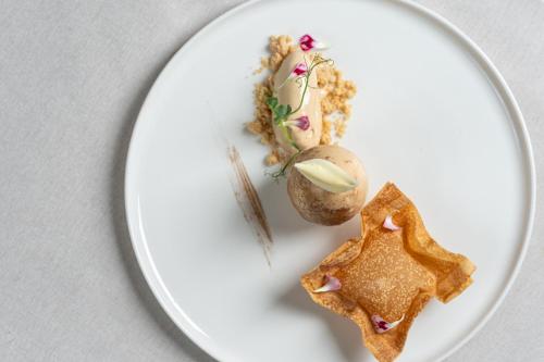 a white plate with a piece of food on it at Airport Hotel Okęcie in Warsaw