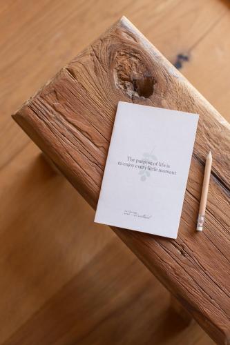 a piece of paper on a wooden bench with a cigarette at La Garriga de Castelladral in Castelladral