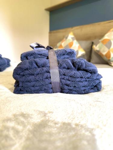a blue towel sitting on top of a bed at The Bay in Filey