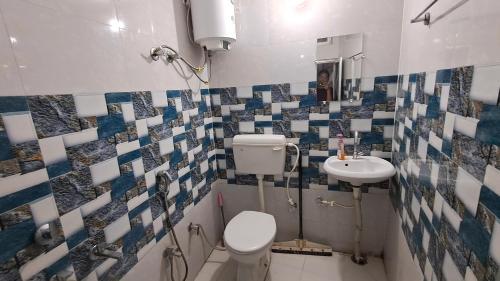 Ein Badezimmer in der Unterkunft Satwik Homestay