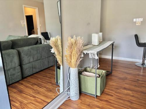 a living room with a couch and a table at Queen Suite - Private Entrance - WiFi in Morrow