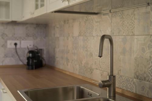 a kitchen with a sink and a counter top at La voce del mare in Agropoli