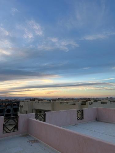 a view from the roof of a building at sunset at Waves Studio La Hacienda in Ras Sedr