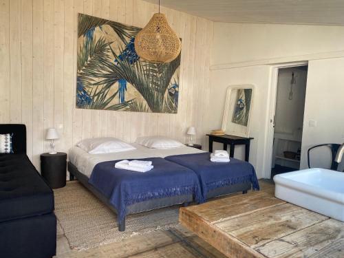Ένα ή περισσότερα κρεβάτια σε δωμάτιο στο Belle et confortable maison